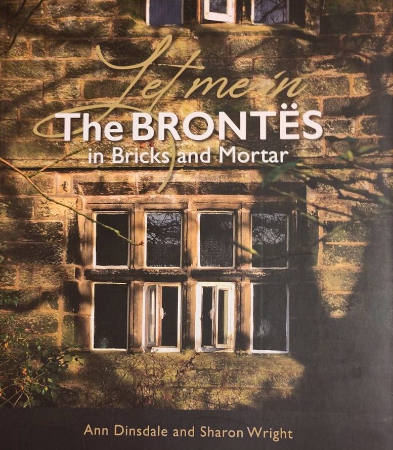 Book cover - The Brontes in bricks and mortar. The cover image is a dark stone building, focused on a large window.