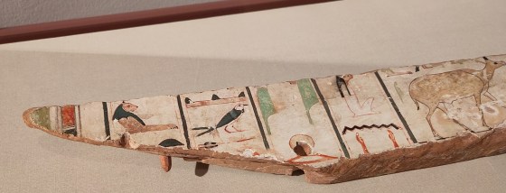 Fragment of painted coffin wood, featuring birds and animals.