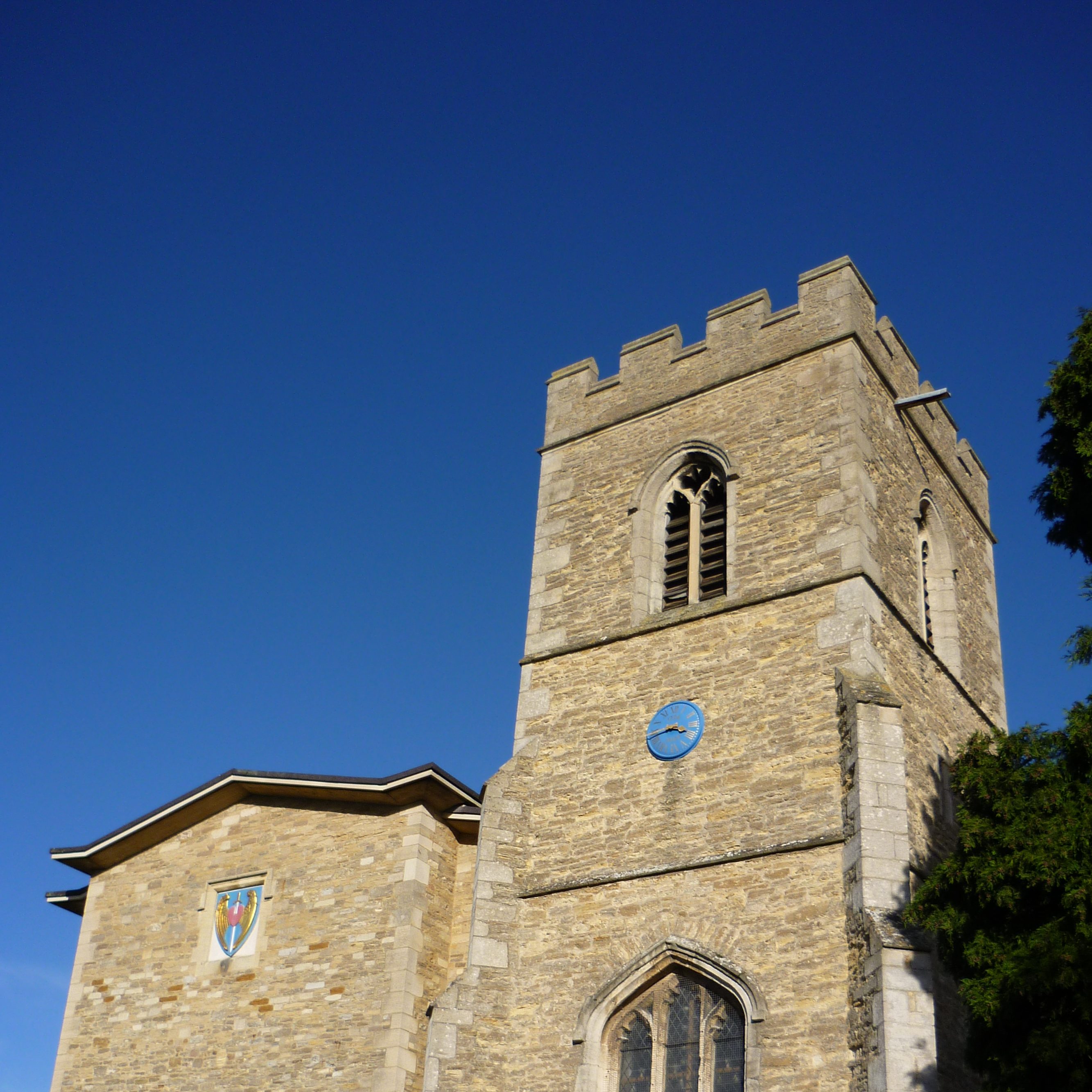 A church tower set against a vibrant blue sky.